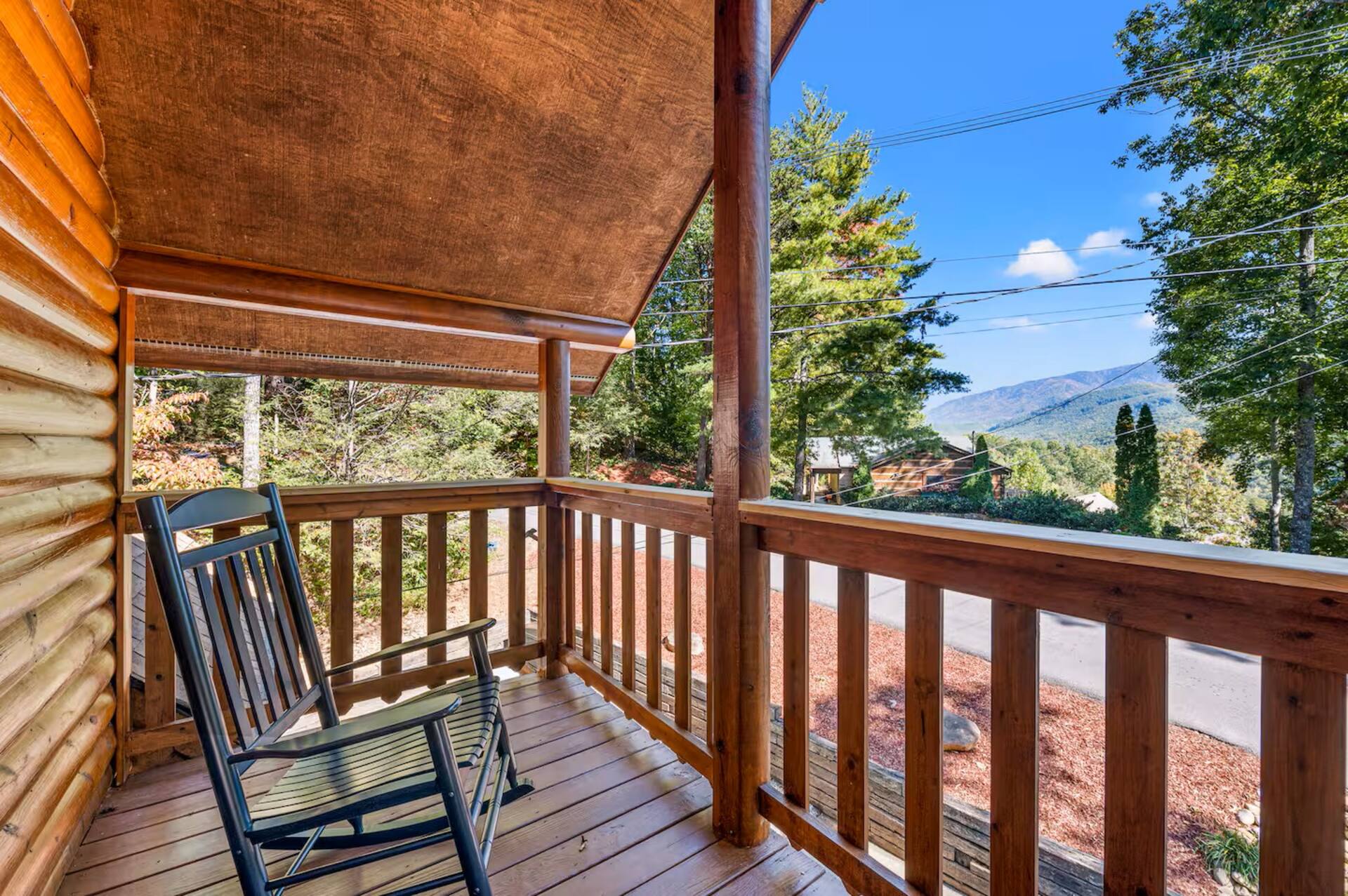Rocking chairs on the front deck with mountain view